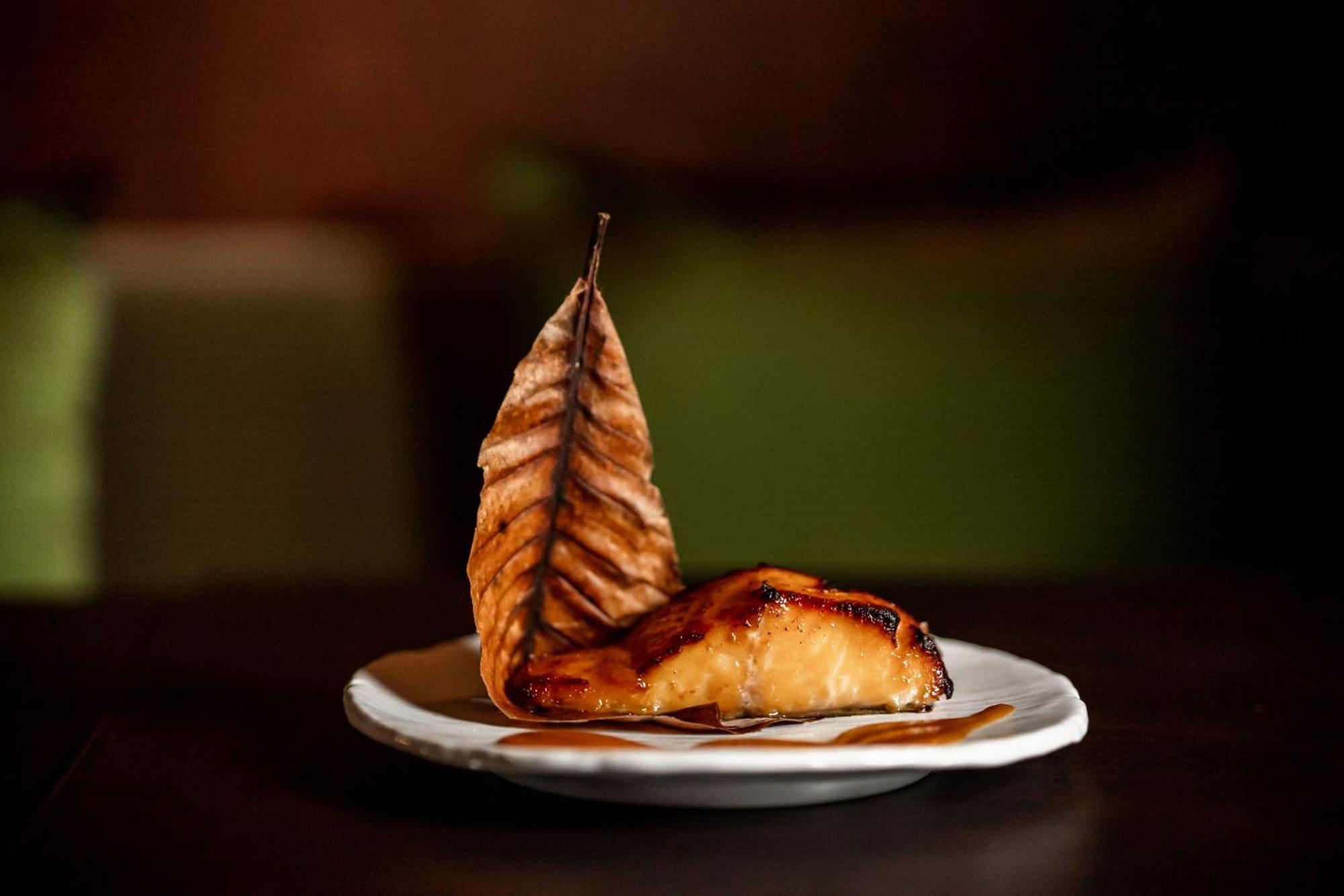 The Dubai Edition Dış mekan fotoğraf Smoked and grilled salmon